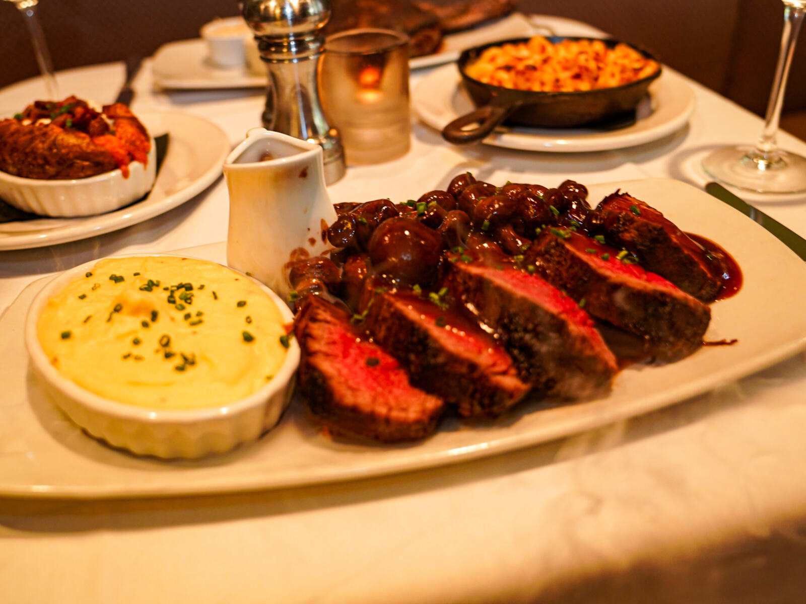 Sliced steak with sides
