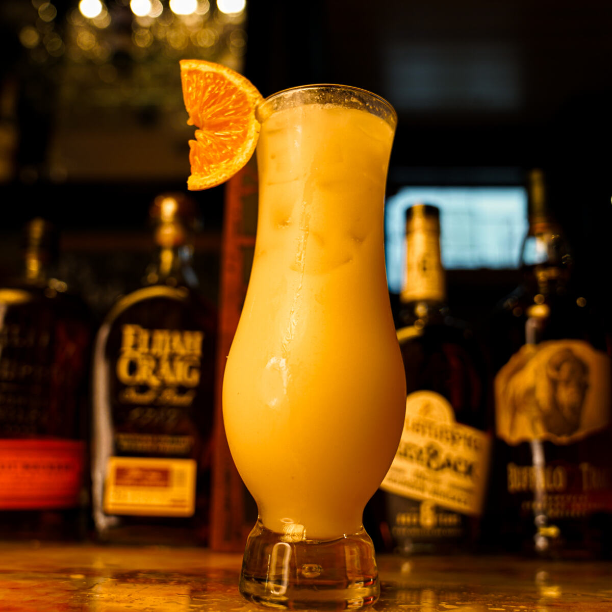 A cocktail catching the bar light