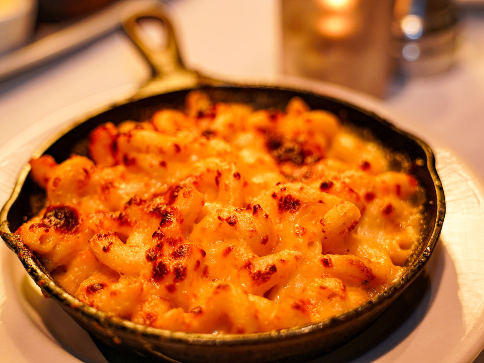 A cast iron skillet of baked mac and cheese